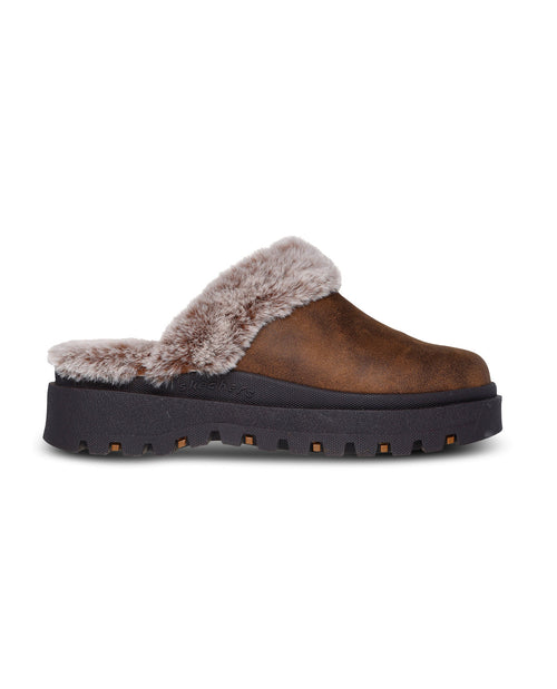 Brown slip-on shoe with fur lining on a white background