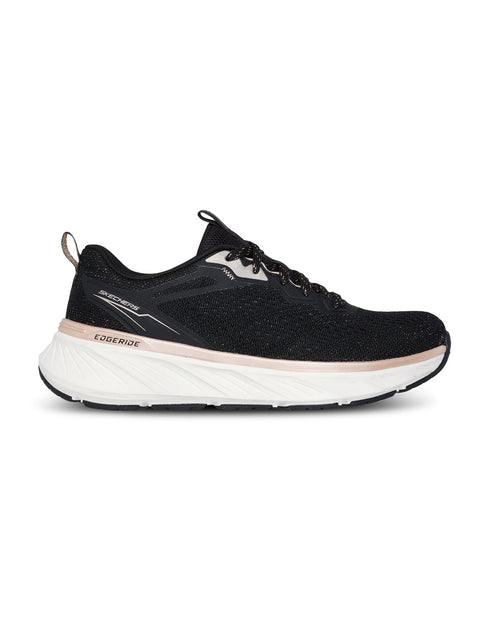Black athletic shoe with white sole on a white background