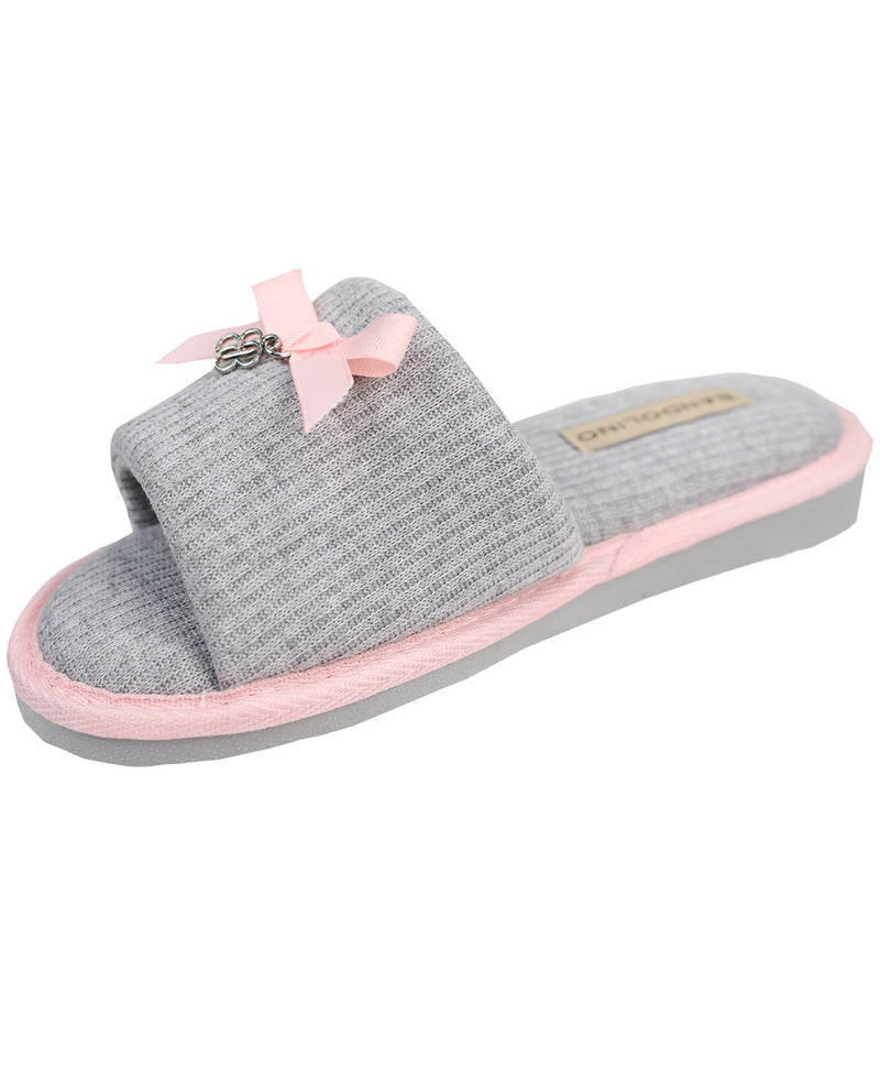 Gray slipper with pink interior and bow on a white background