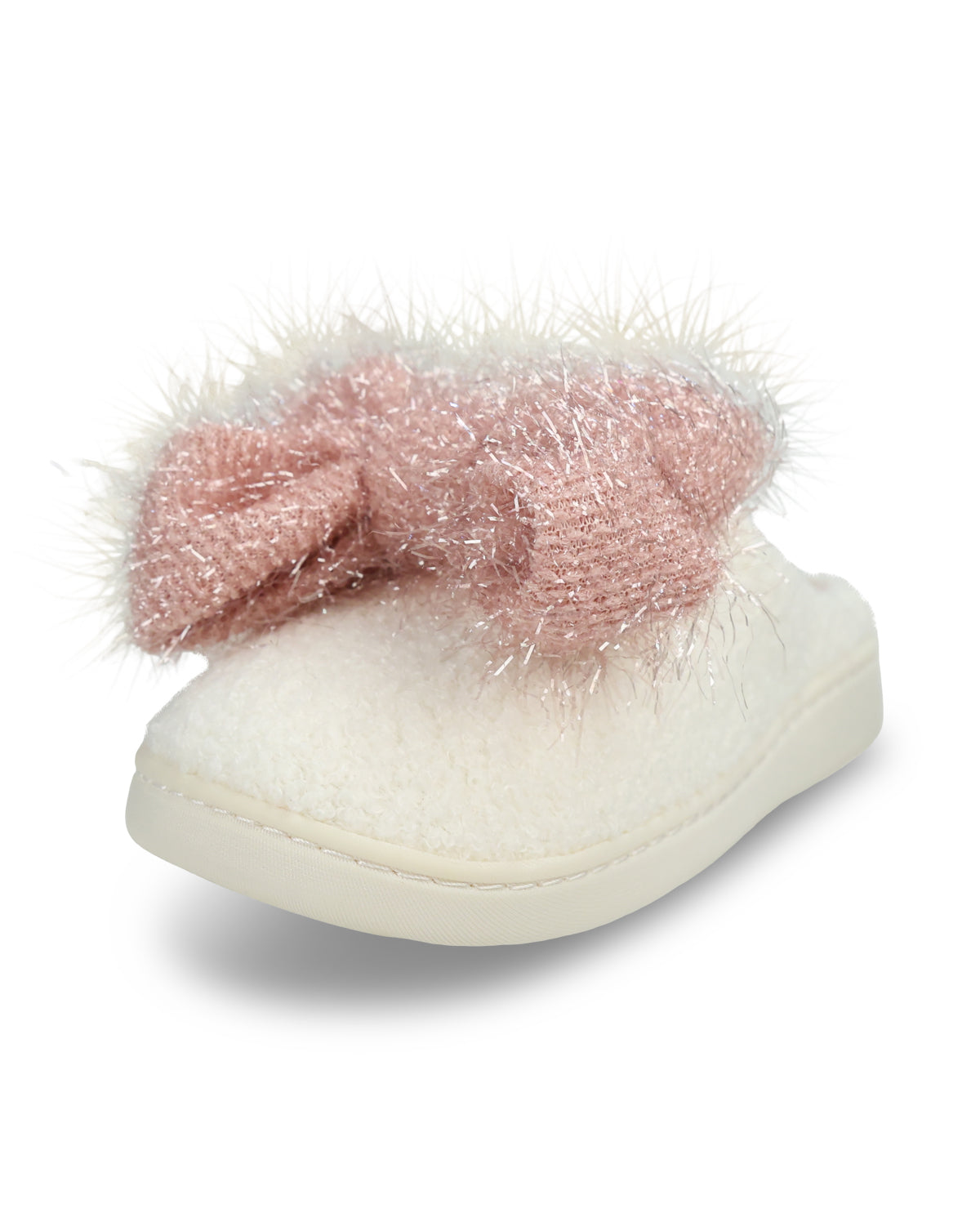A single slip-on slippers featuring a fluffy cream-colored faux fur body and a large, sparkly dusty pink bow on top, set against a plain white background.