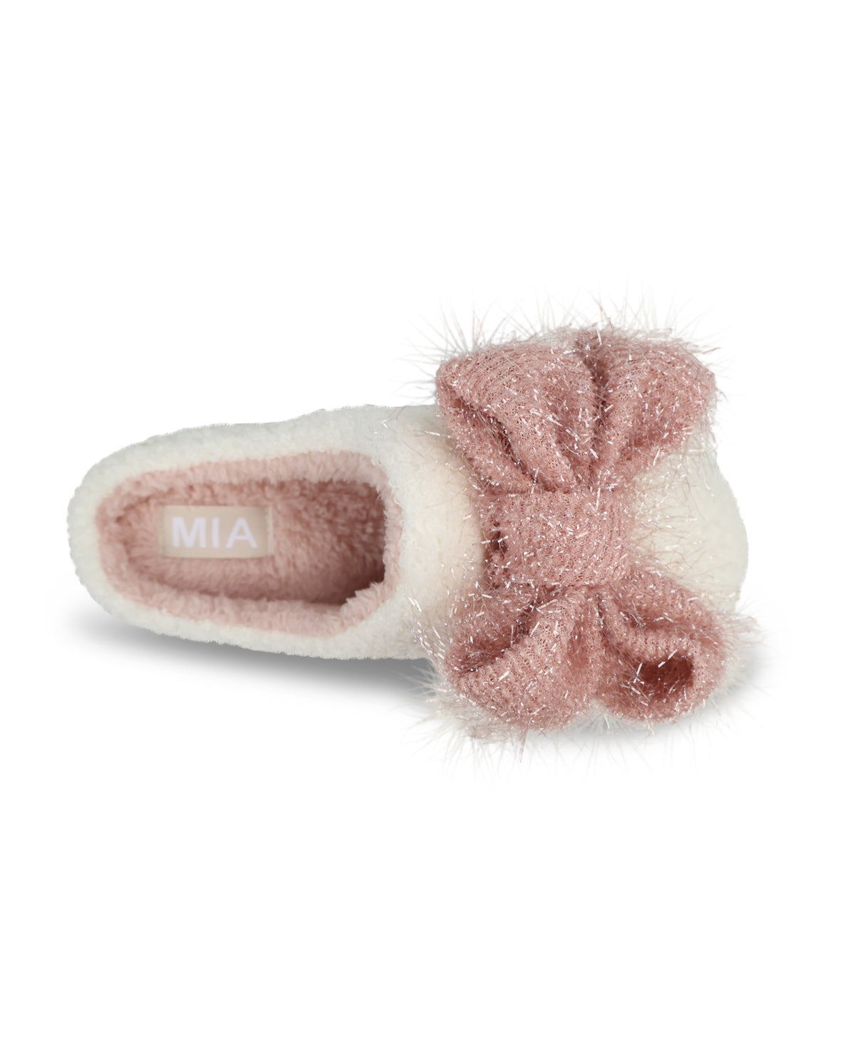 A single plush slipper in cream faux fur with a large, sparkly dusty pink bow on the side, shown on a clean white background. The brand name 'MIA' is visible on the inner sole.