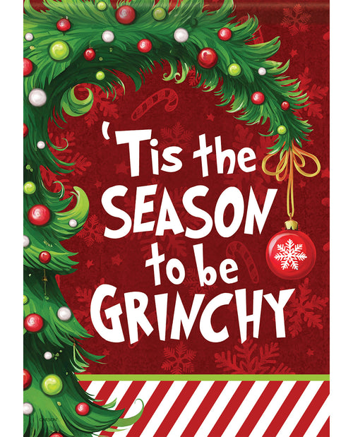 Christmas-themed poster with 'Tis the Season to be Grinchy' text on a red background with greenery and ornaments.