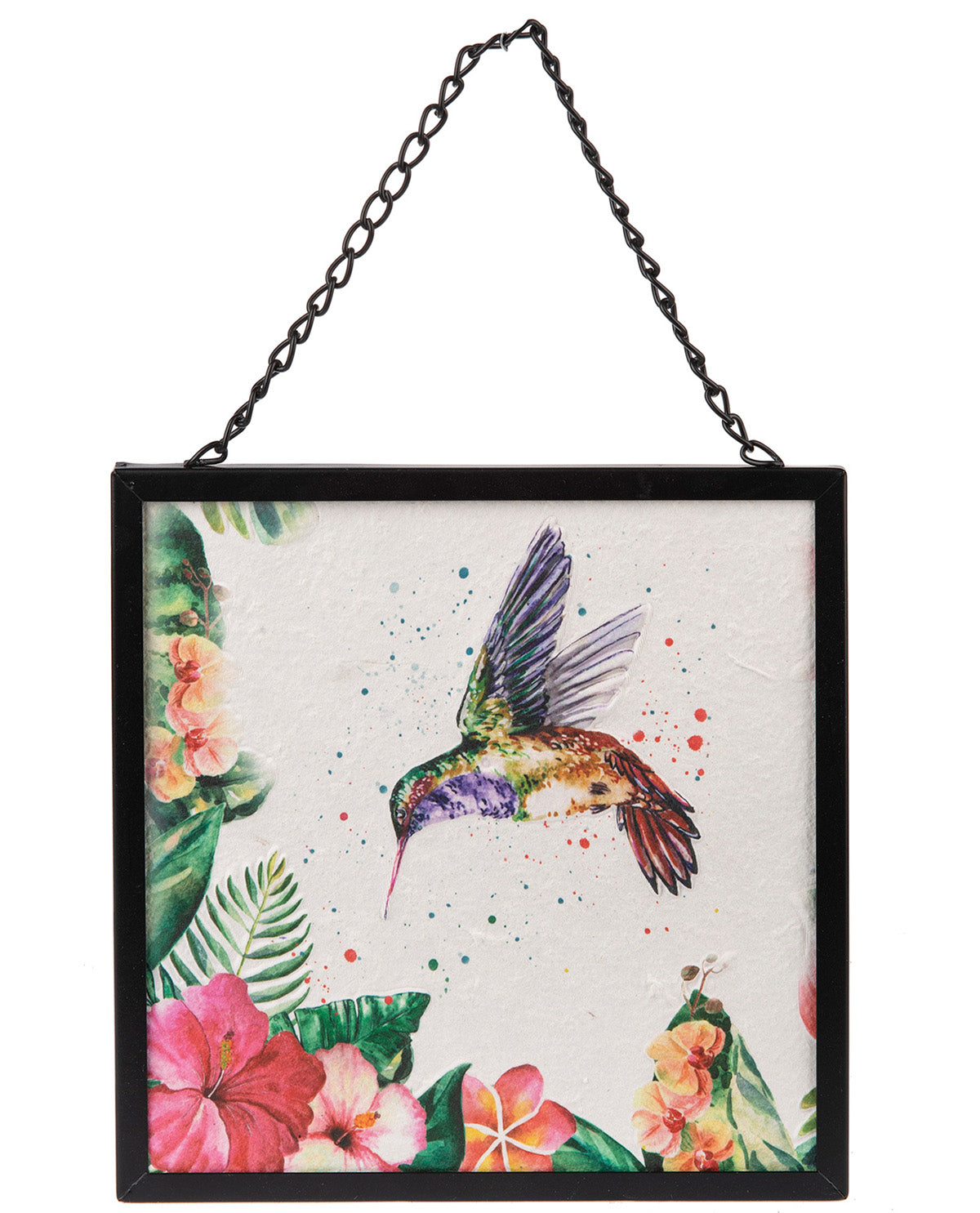A square framed wall hanging featuring a colorful watercolor-style hummingbird in flight above tropical flowers, suspended by a black metal chain against a white background.