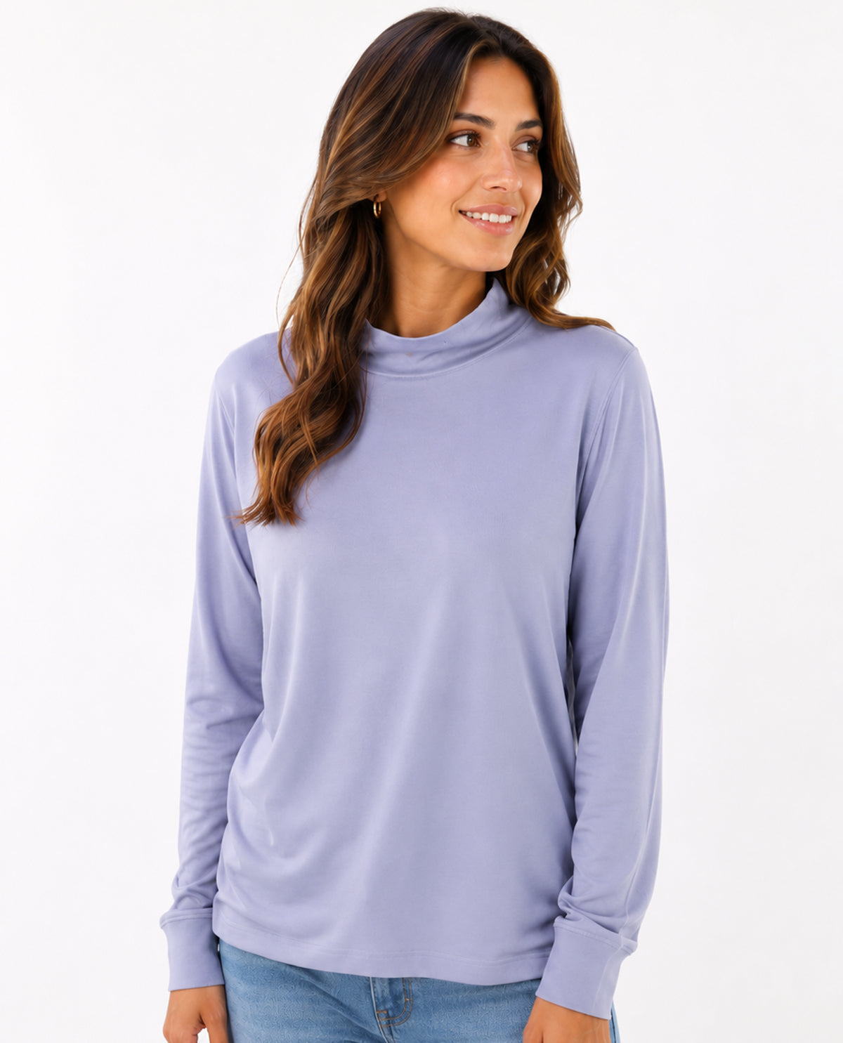Woman wearing a light purple long-sleeve top on a white background