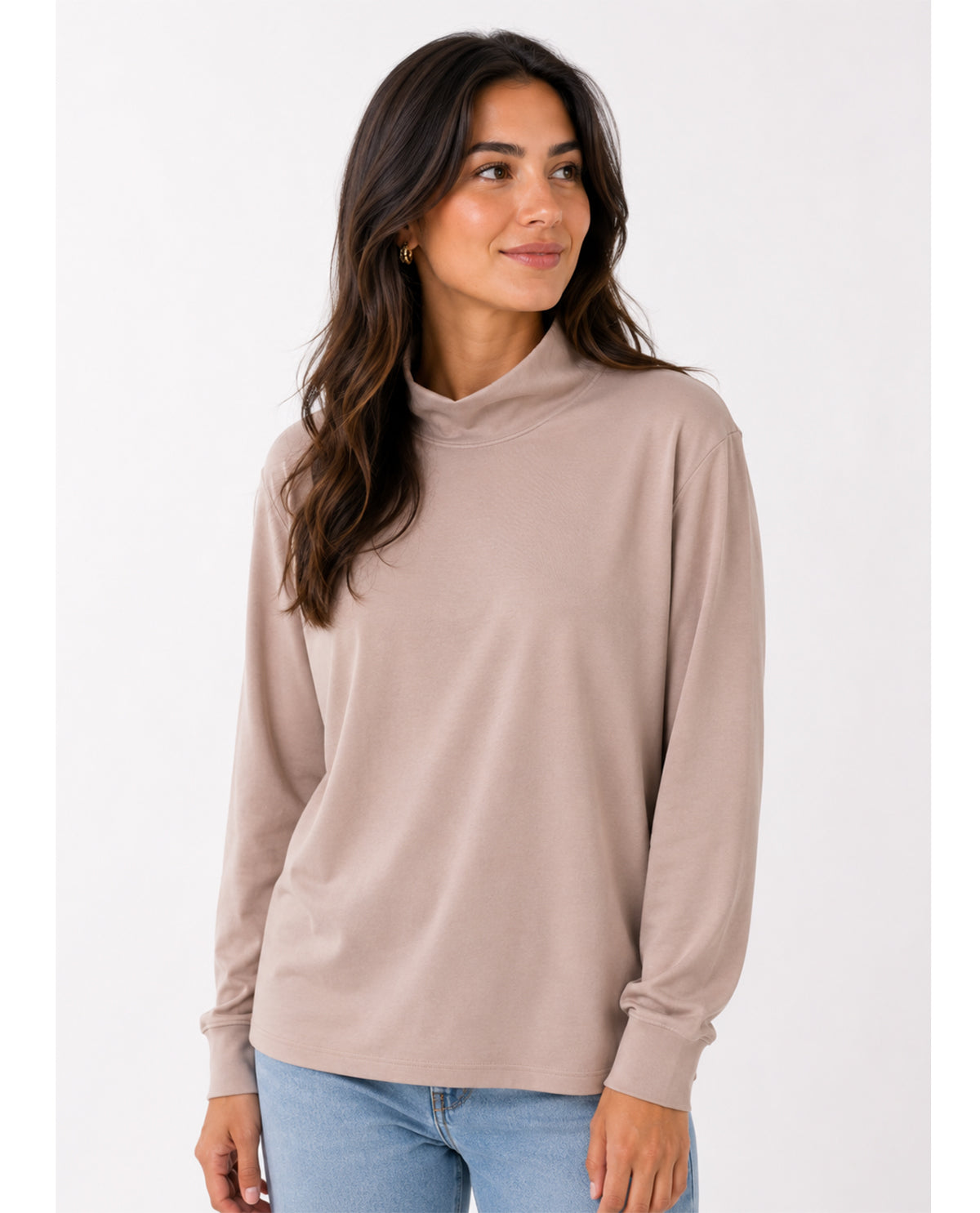 Woman wearing a beige long-sleeve top on a white background