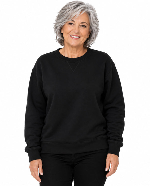 Model wearing a black top with a white background