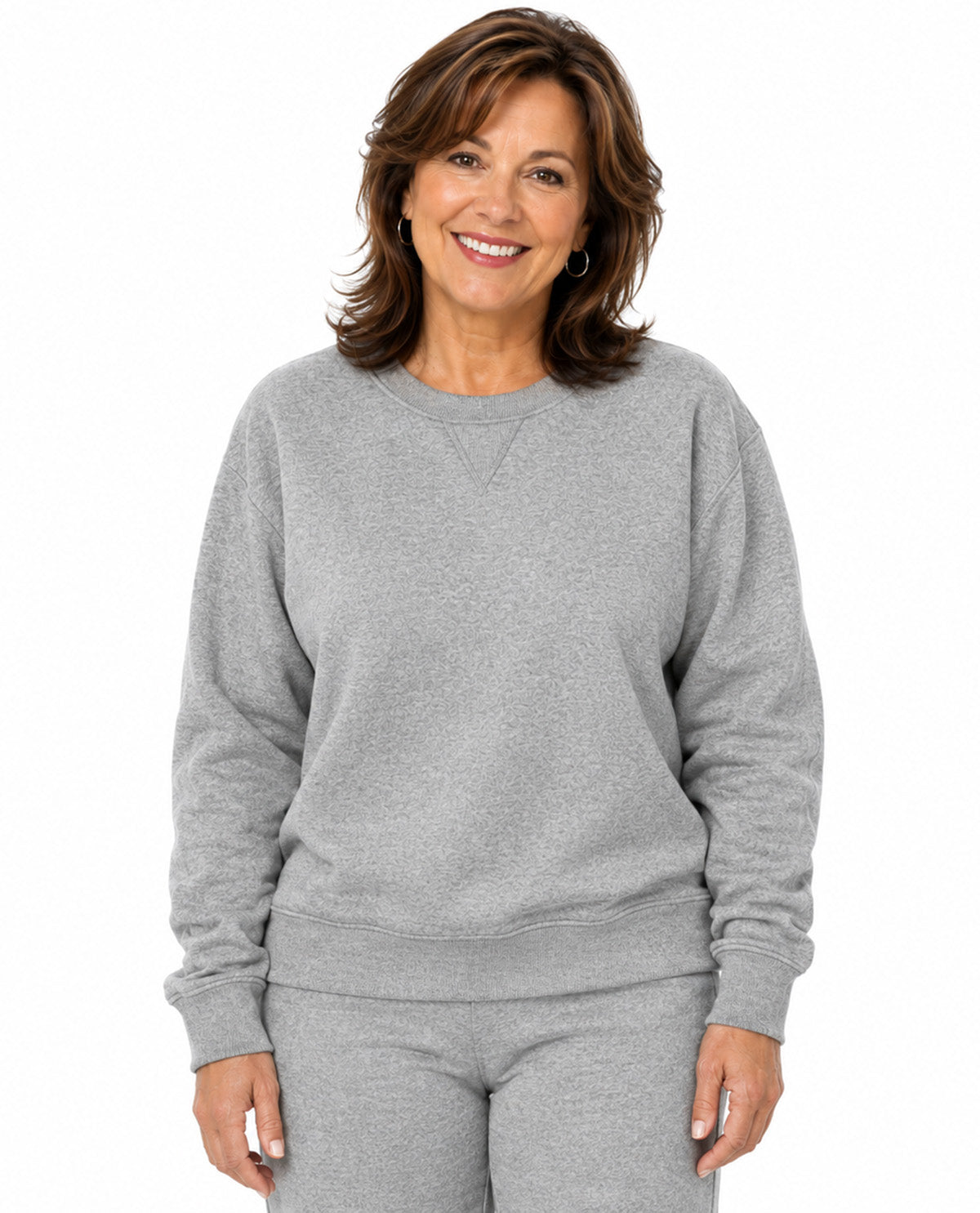 Model wearing a gray top with a white background