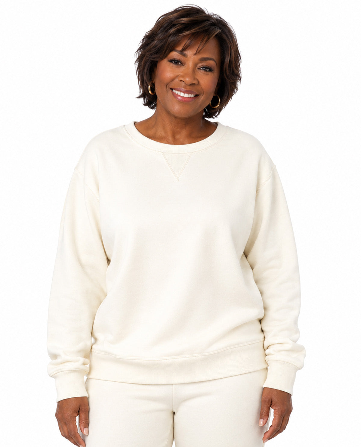 Model wearing an ivory top with a white background