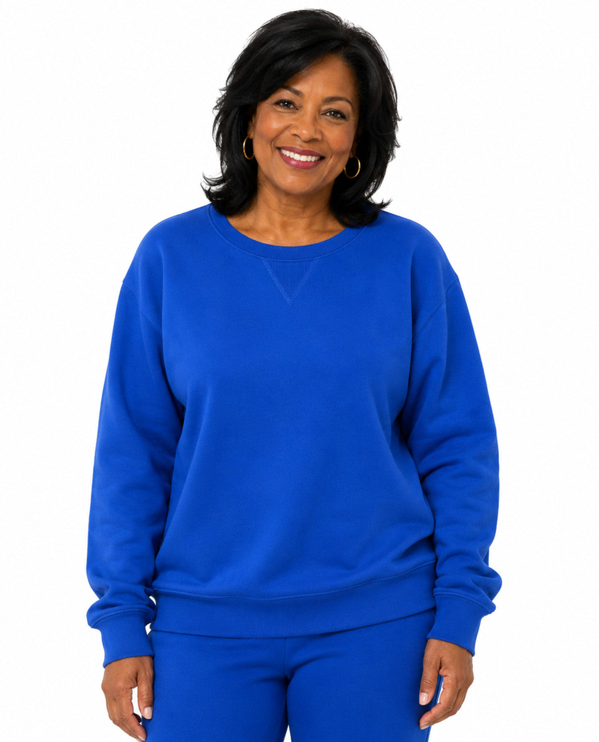 Model wearing a blue top with a white background