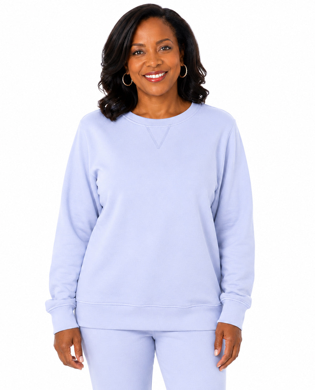 Model wearing a lilac top with a white background