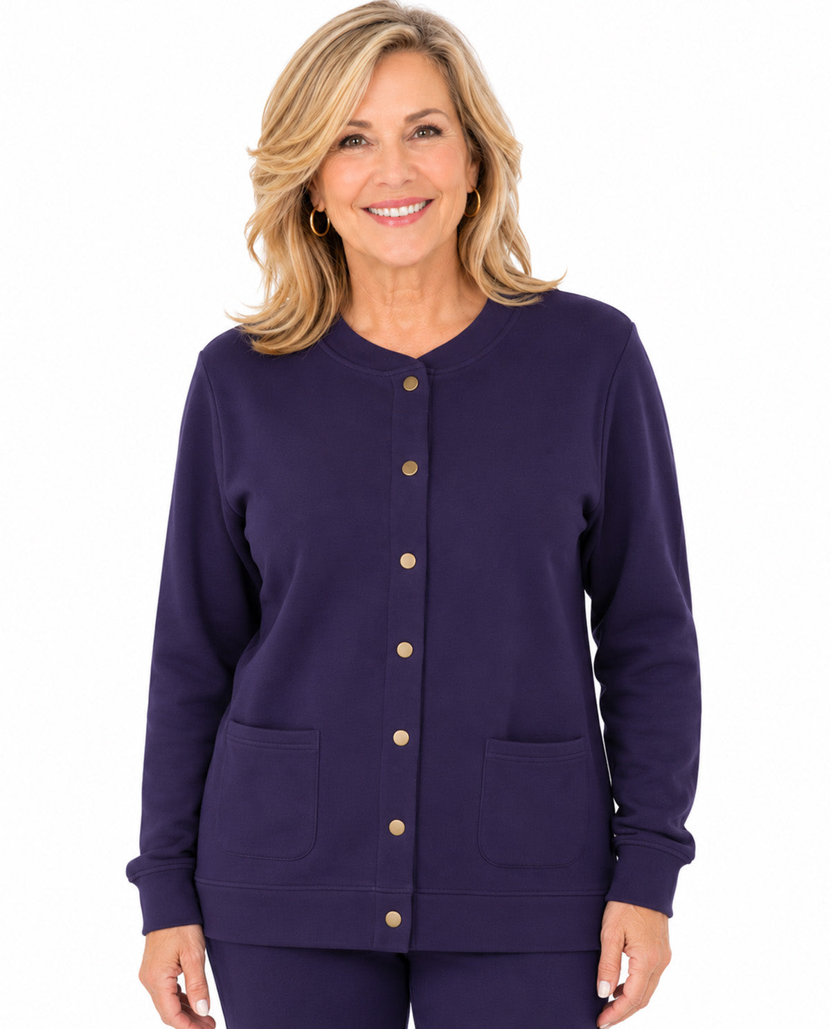A smiling blonde woman wearing a dark purple long-sleeve button-front cardigan with two front patch pockets, shown against a plain white background.