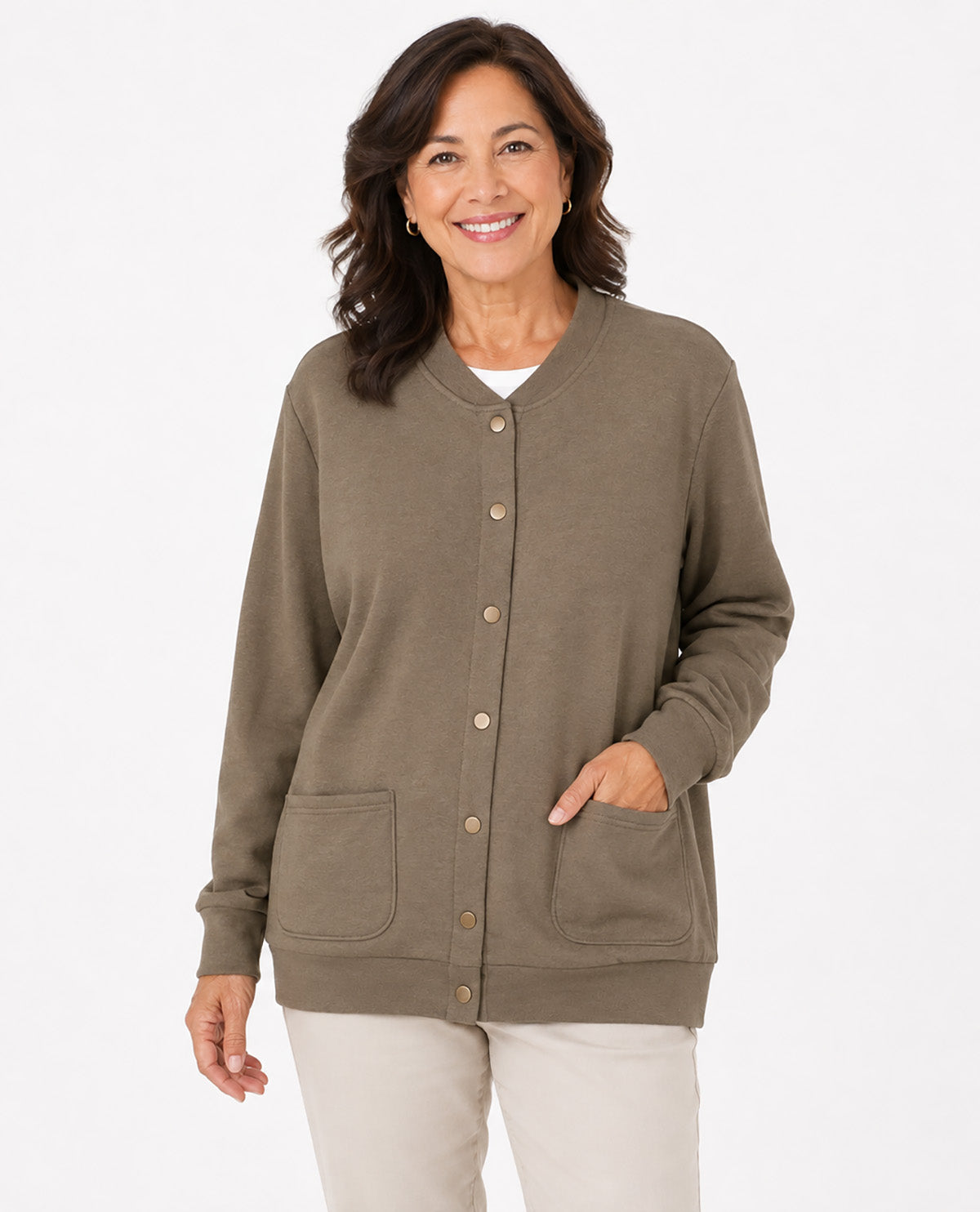 A woman modeling a taupe brown button-down cardigan sweater with front pockets, paired with light beige pants, against a plain white studio background.