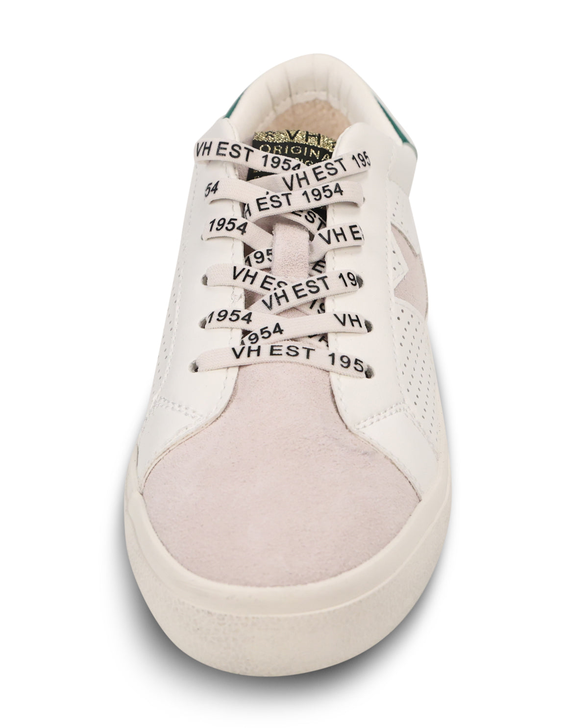 A low-top sneaker in off-white and pale pink suede, featuring black printed text on the laces that reads 'VH EST 1954'.