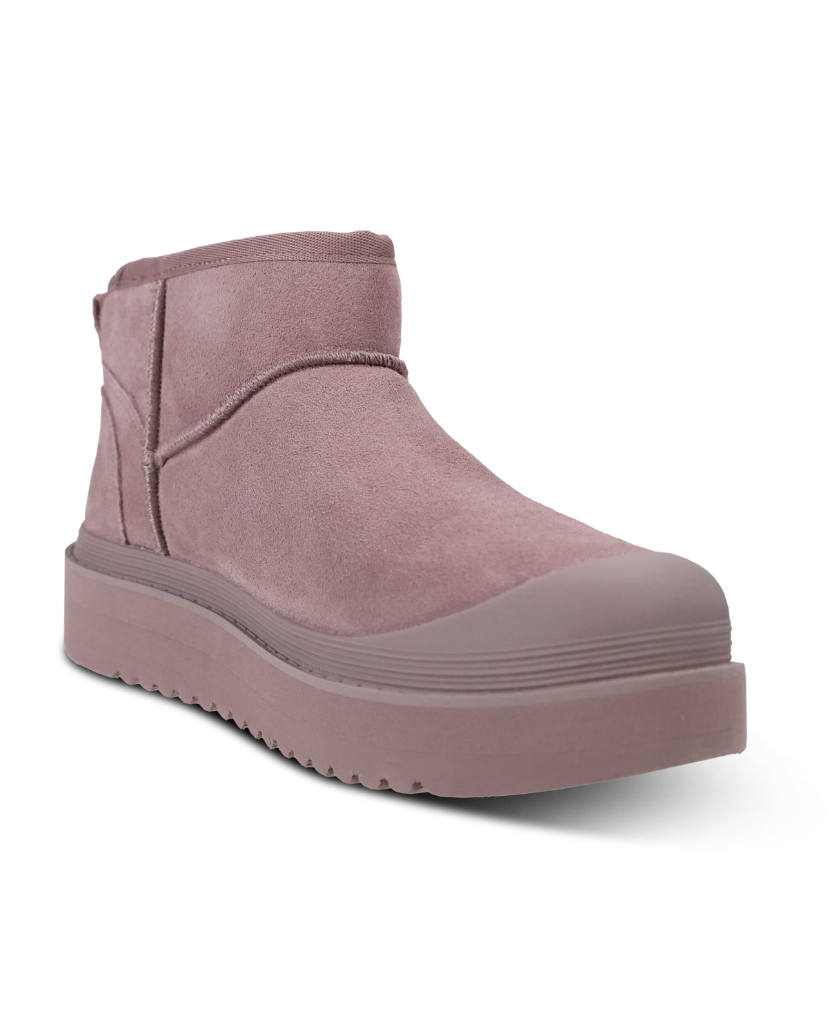 A single dusty rose suede ankle boot with a chunky platform sole, shown from a three-quarters angle on a white background.