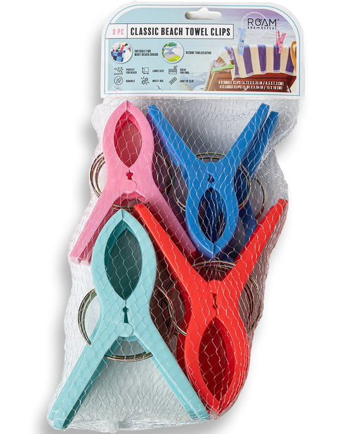 Set of colorful beach towel clips in packaging with 'ROAM' branding.