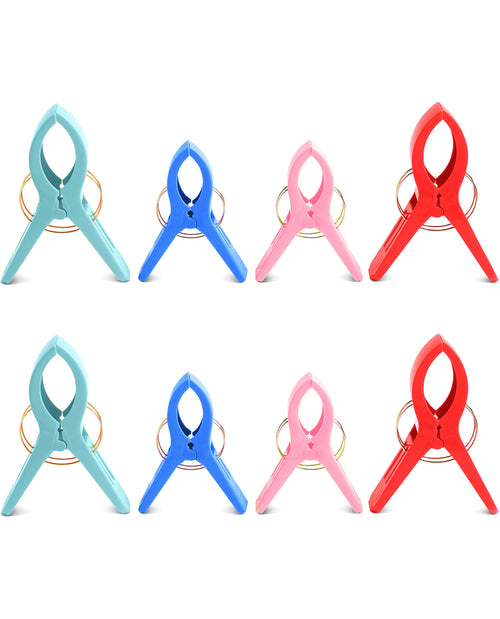 Set of six colorful clothespins on a white background
