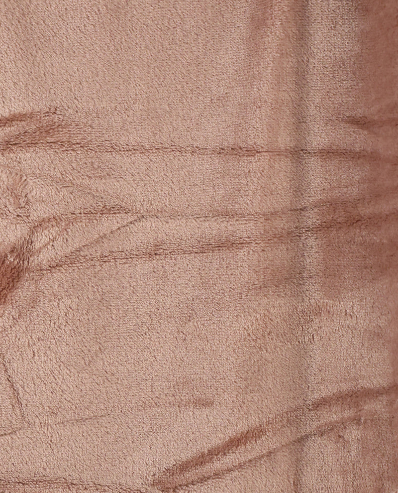A close-up of a soft, plush fabric texture in a dusty rose or mauve color, showing the fine woven fibers and subtle tonal variations.