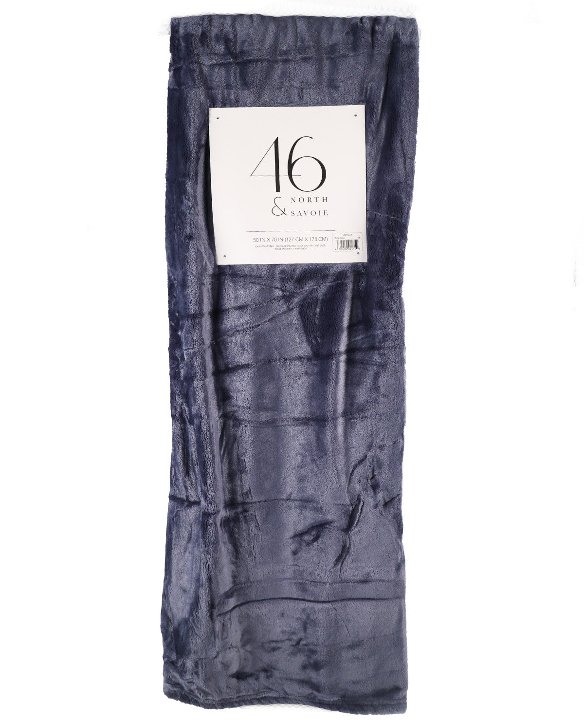 A folded dark navy blue plush blanket with a white paper label that reads '46 Comfort & Softie' on a plain white background.