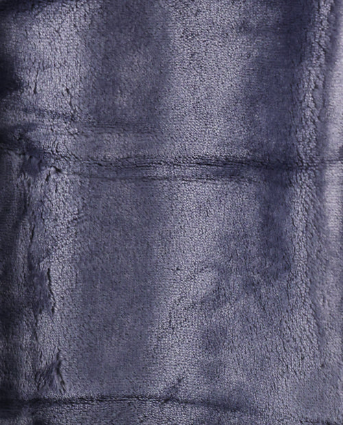 A close-up of a plush, textured fabric in a dark slate blue or navy color, showing the soft pile and stitched panel seams.