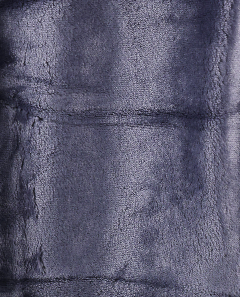 A close-up of a plush, textured fabric in a dark slate blue or navy color, showing the soft pile and stitched panel seams.