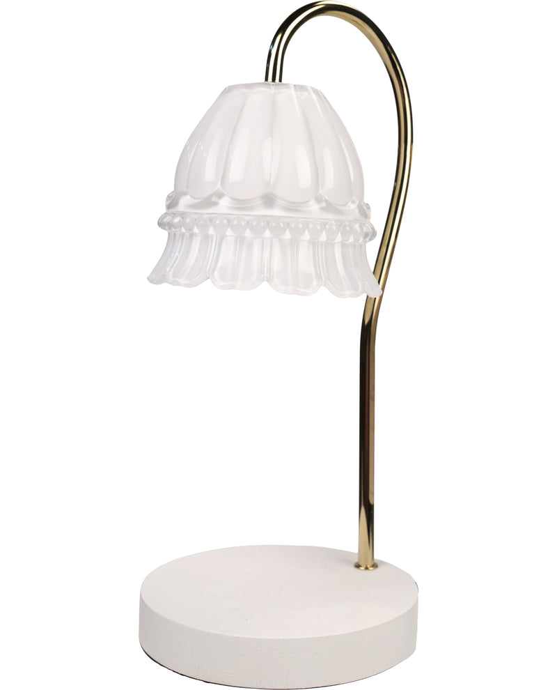Table lamp with white shade and gold arm on a white background