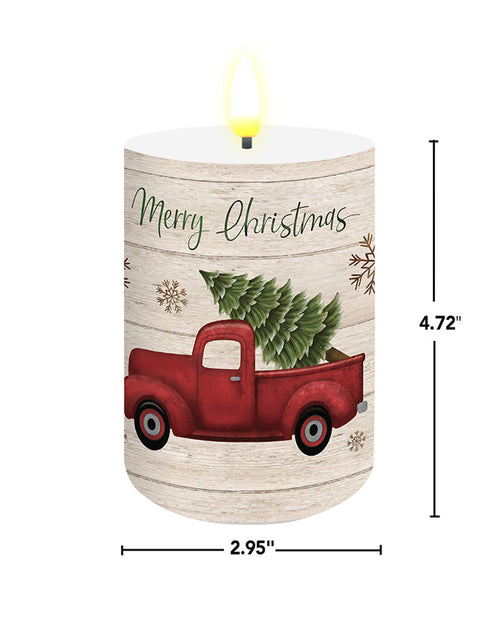 Decorative candle with a red truck and Christmas tree design, featuring 'Merry Christmas' text.