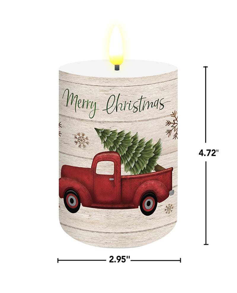 Decorative candle with a red truck and Christmas tree design, featuring 'Merry Christmas' text.