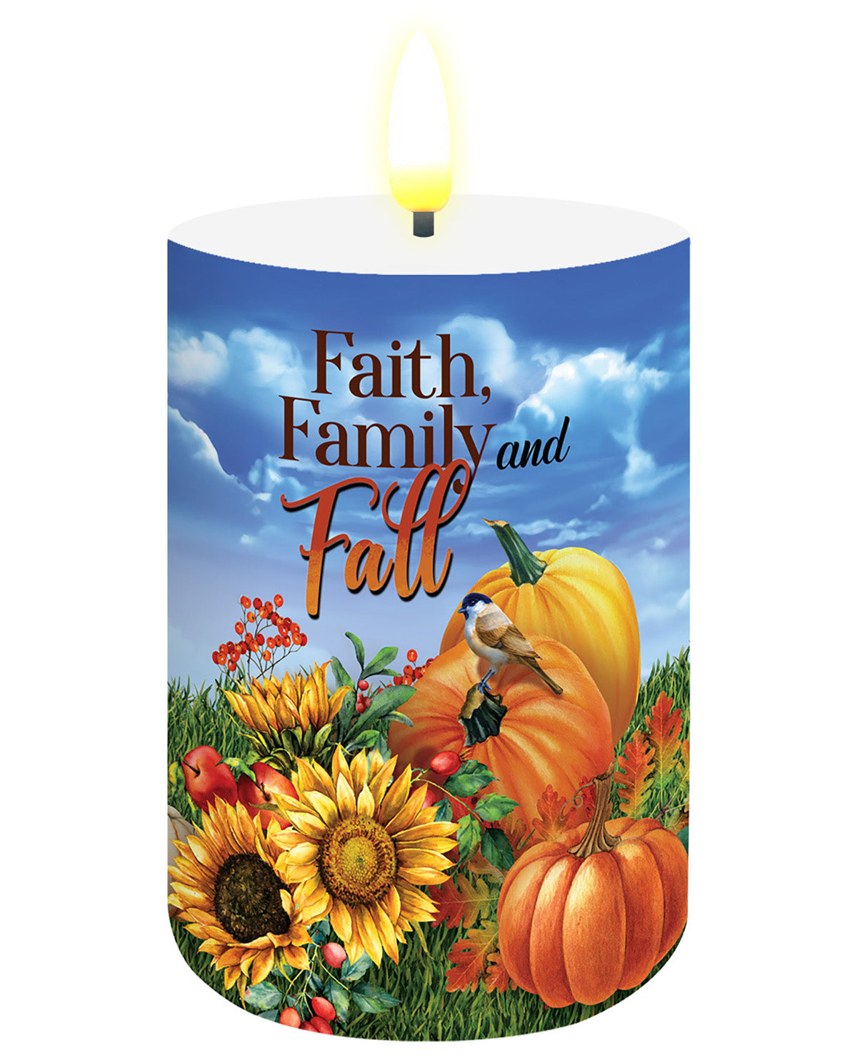 A lit white pillar candle featuring a printed autumn scene with pumpkins, sunflowers, birds, and the words “Faith, Family and Fall” on a blue sky background.