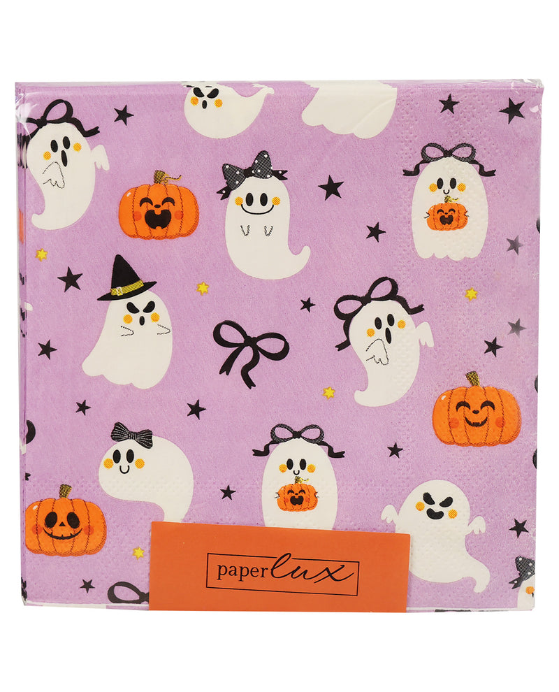 A square paper napkin with a light purple Halloween pattern featuring cartoon ghosts, pumpkins, black bows, stars, and an orange paper band at the bottom that reads 'paperlux'.