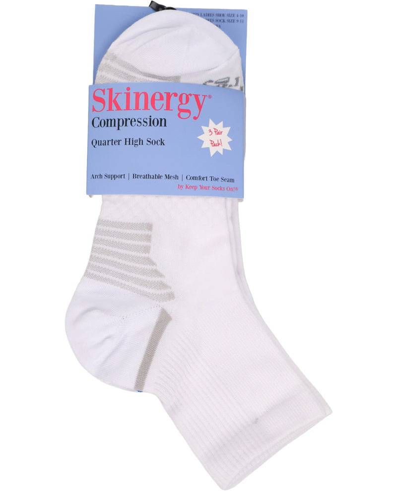 A pack of three Skinergy Compression Quarter High Socks in white, shown with their blue and white retail packaging on a plain white background.