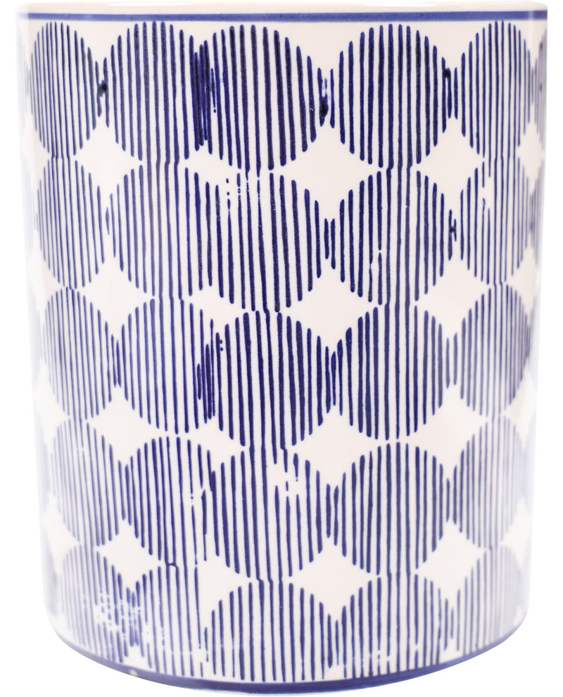 Cylindrical container with blue and white geometric pattern