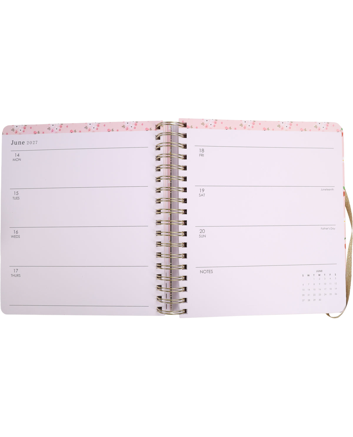 Open planner with pink floral design on a white background