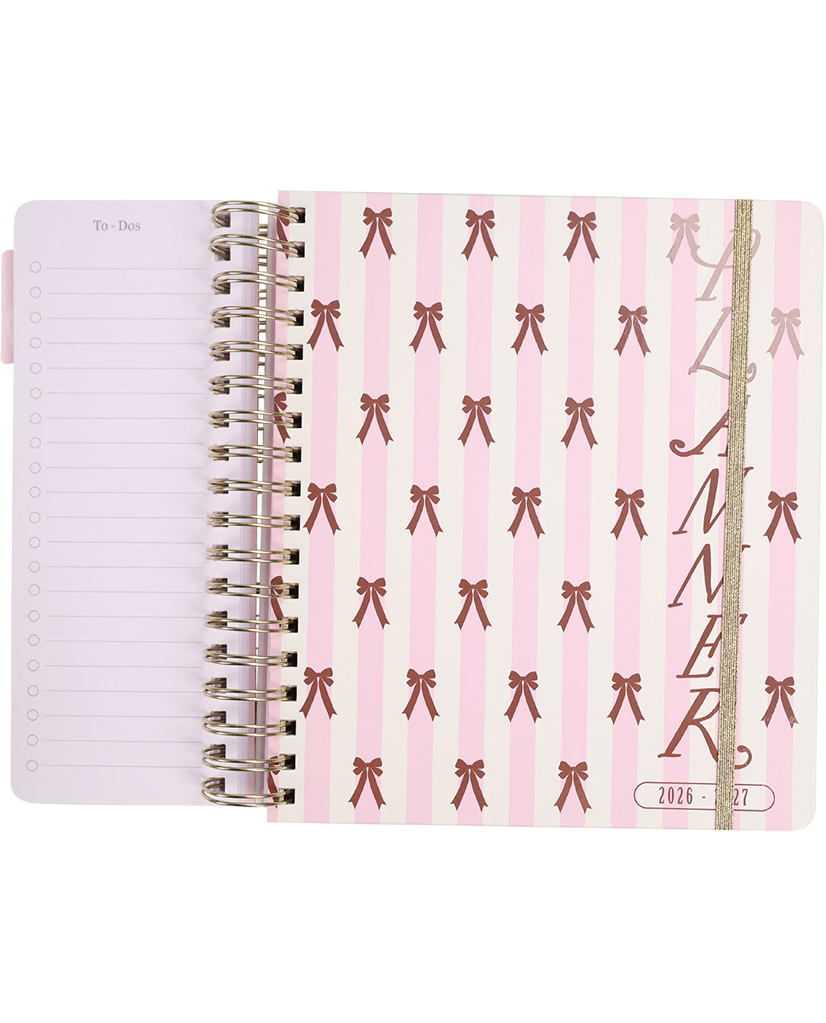 Pink planner with bow pattern and gold spiral binding on a white background