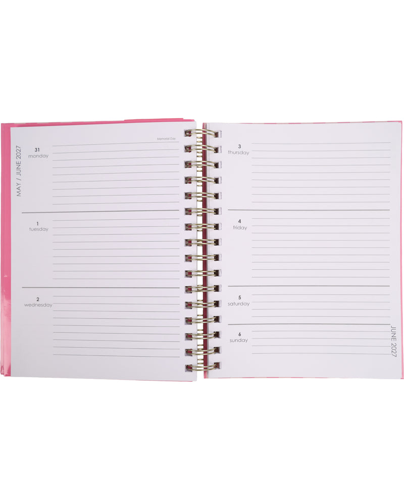 Open planner with pink cover and white pages on a white background