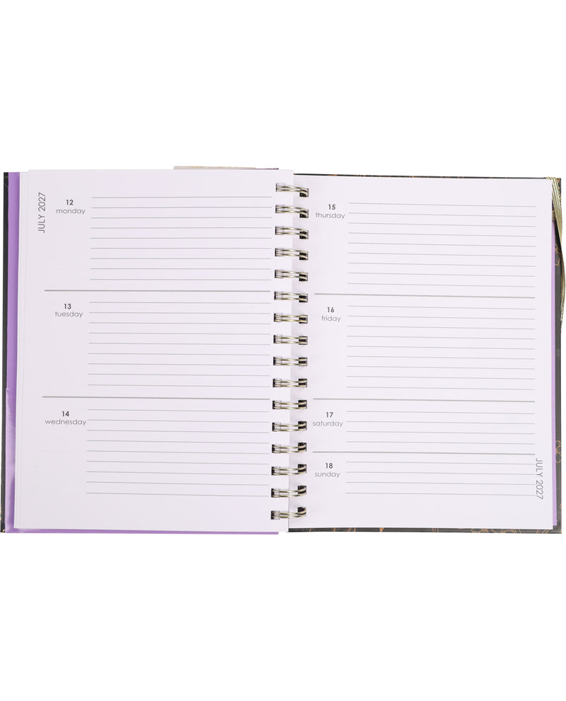 Open planner with a purple cover on a white background