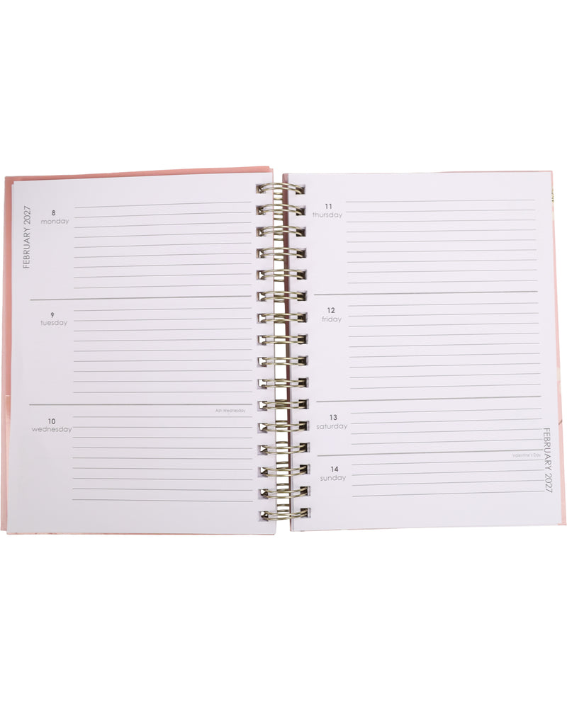 Open planner with a pink cover on a white background