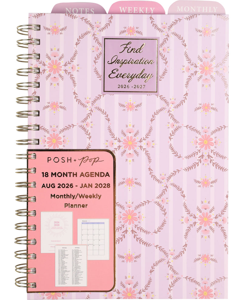 Planner with floral design and pink front cover on a white background