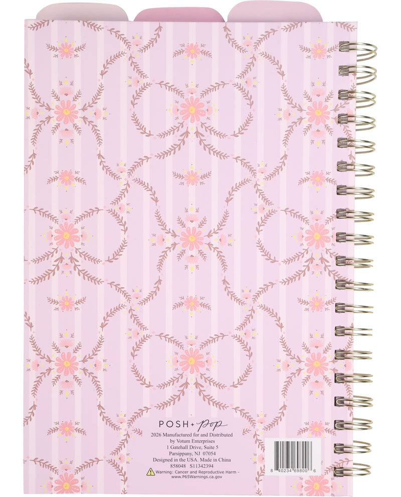 Spiral-bound notebook with floral pattern on a light purple background