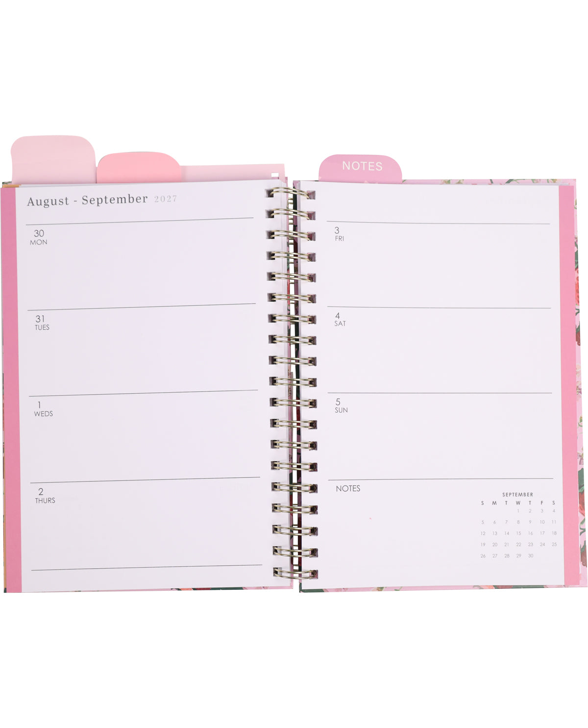 Open planner with pink cover and tab labeled 'Notes' on a white background