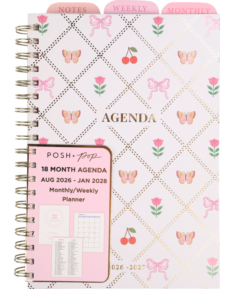 Pink and white planner with butterfly and bow pattern, featuring the brand 'Posh'.