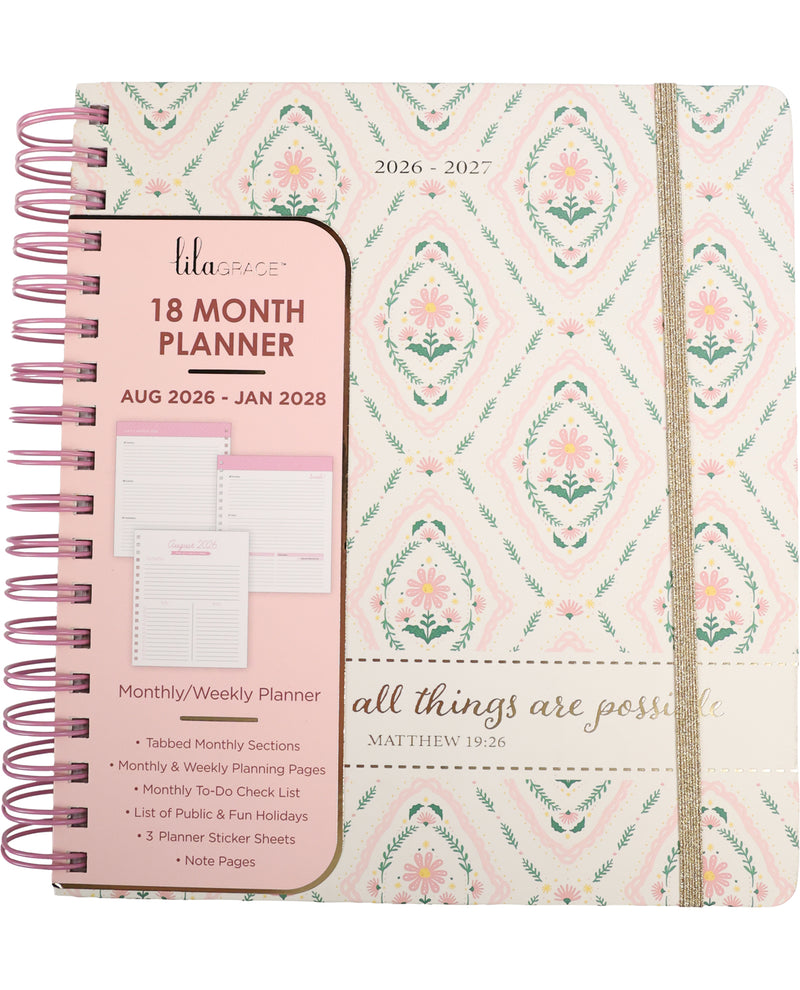 Planner with floral design and pink cover on a white background