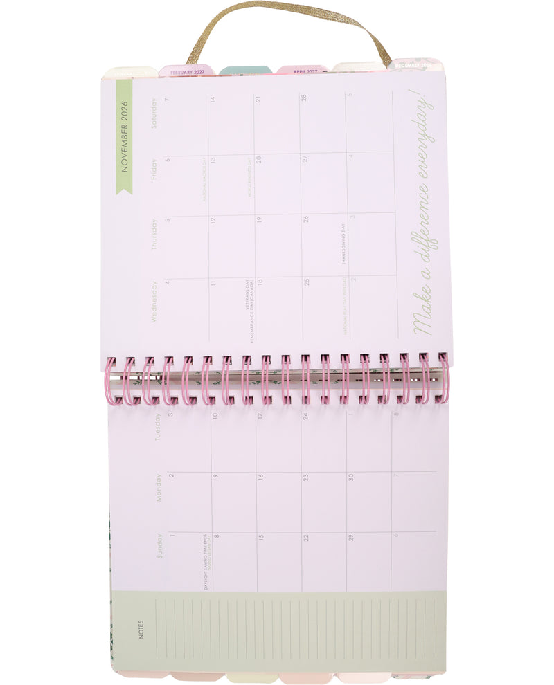 Pink planner with a grid layout on a white background