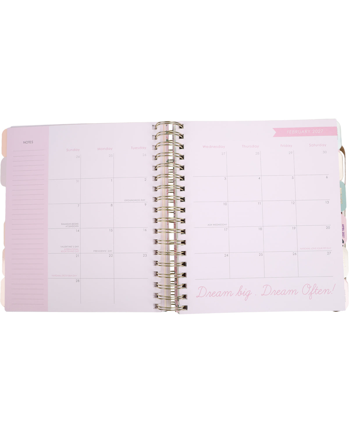 Pink planner with a white cover on a white background