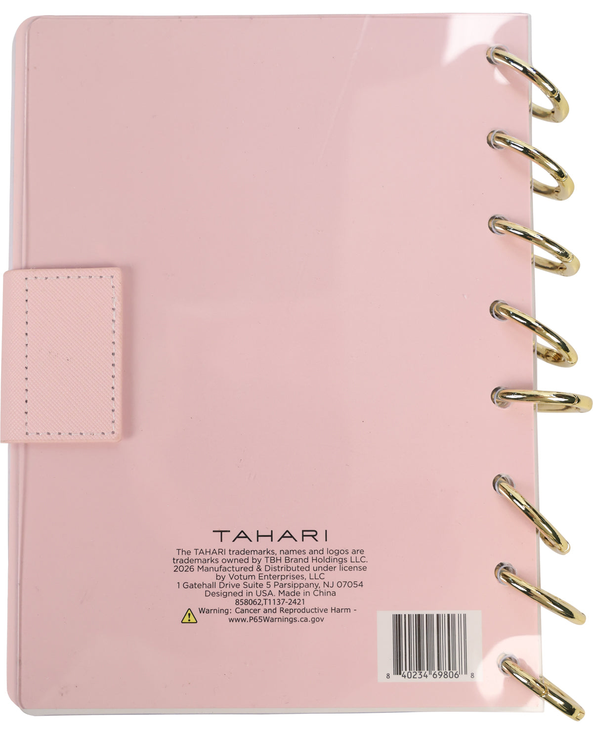 Pink planner with gold rings on a white background