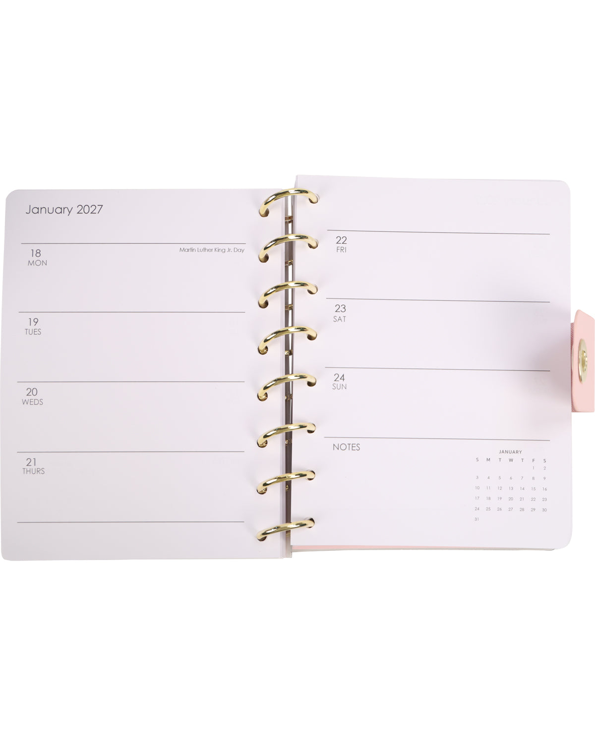 Open planner showing January 2023 with a pink cover on a white background