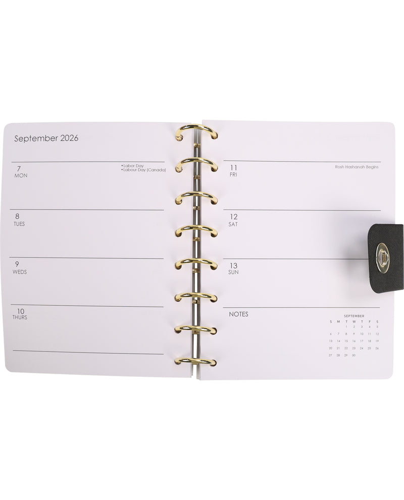 Planner with gold binding on a white background