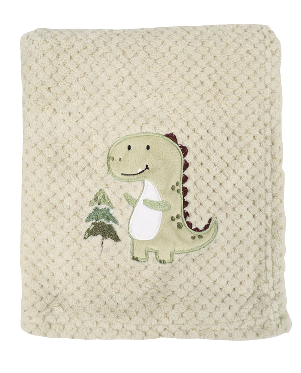 Beige textured blanket with a dinosaur applique on a white background
