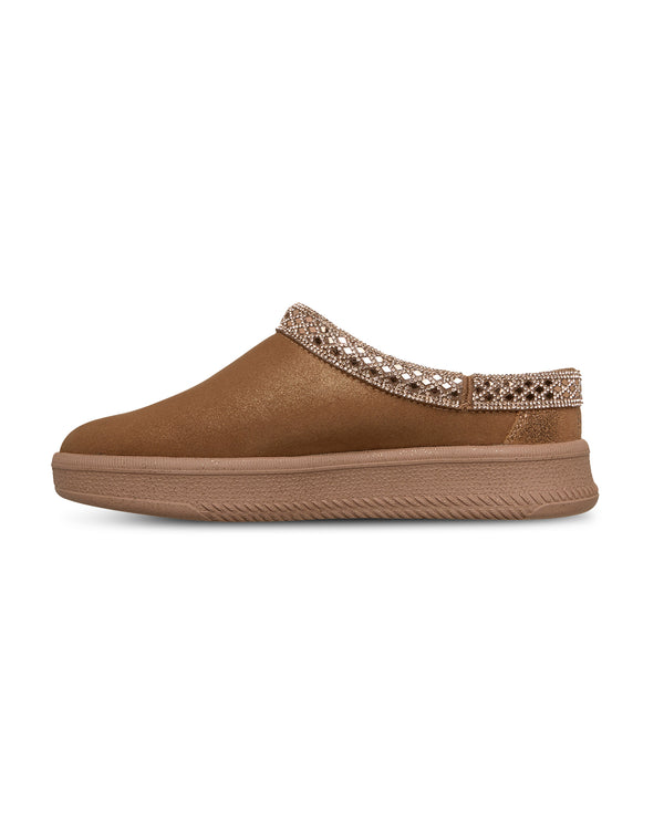 Brown slip-on shoe with decorative strap on a white background