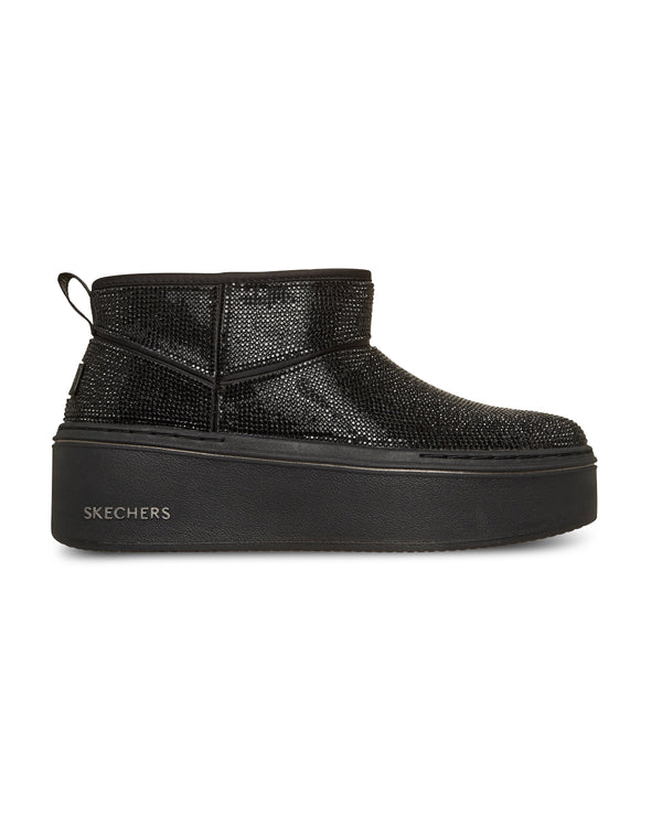 Black platform sneaker with rhinestone details on a white background