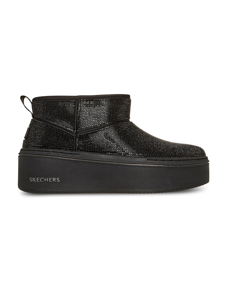 Black platform sneaker with rhinestone details on a white background